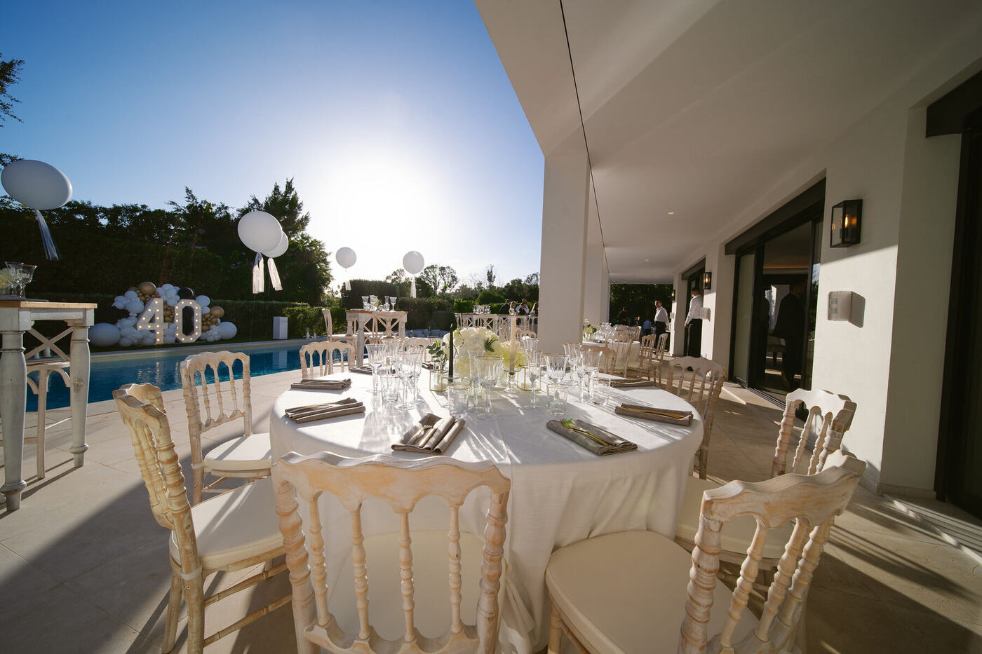 Poolside dining area set up for a 40th birthday party, Marbella villa