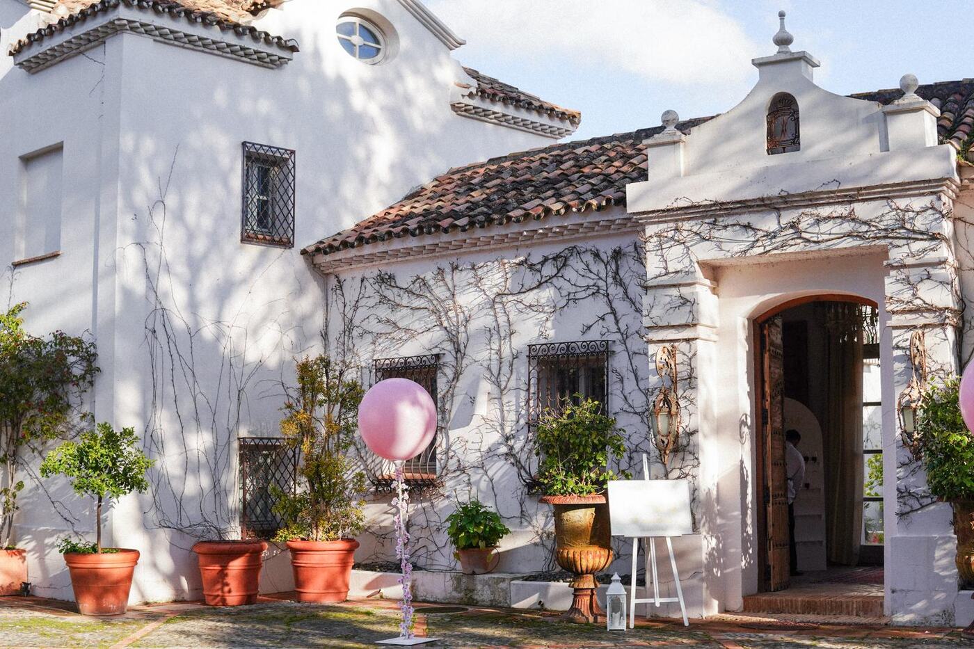 Villa entrance with a giant pink balloon and welcome sign, 18th birthday Marbella